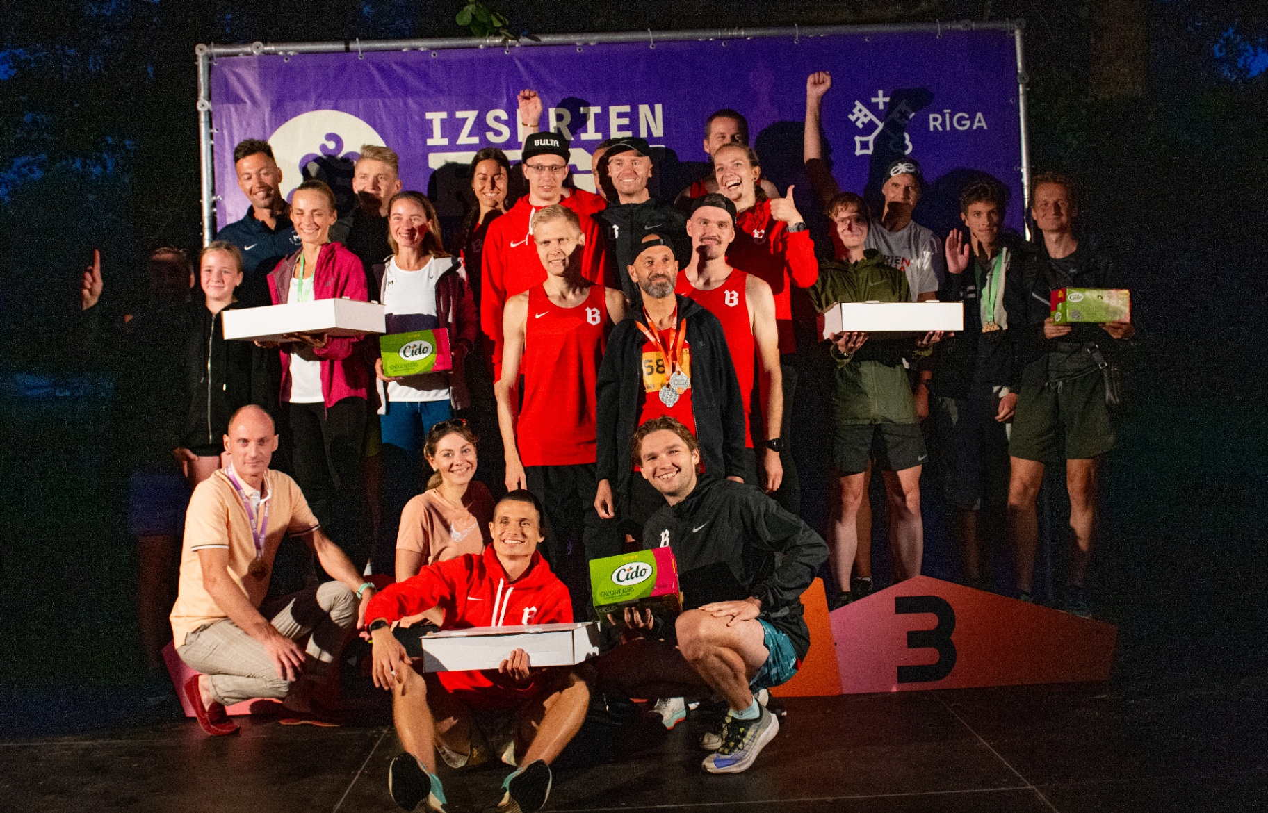 SK BULTA team celebrating on the podium at Izskrien Rīgu