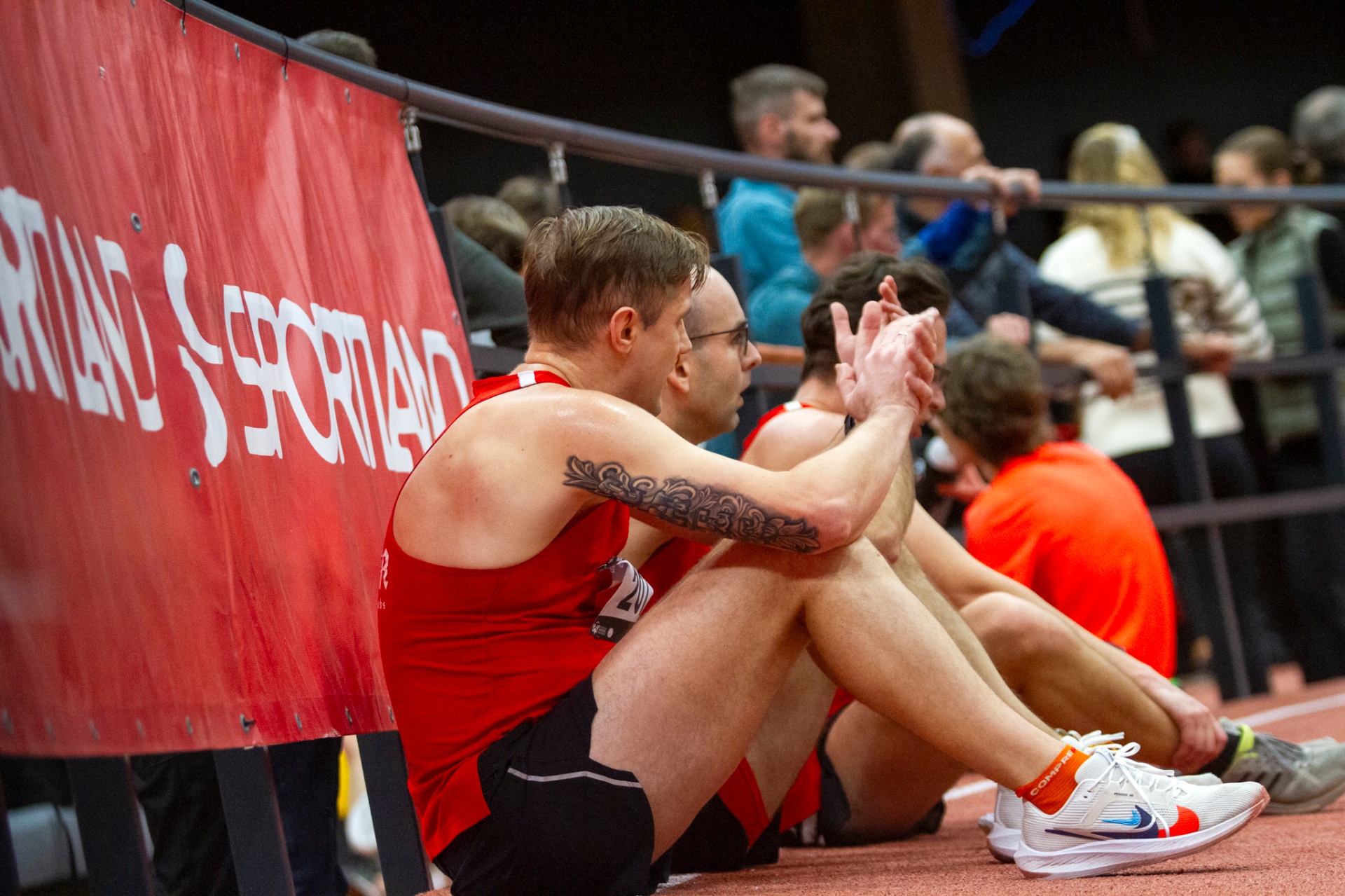 SK BULTA runners resting trackside after competing